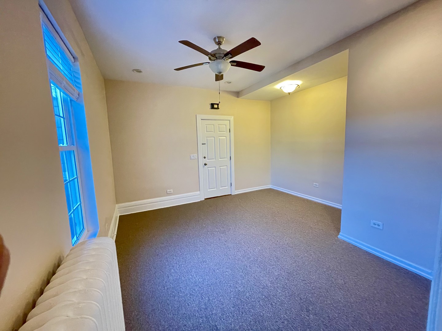 72 North 4th Street, Unit 4 Aurora, IL 60505 - Photo 9 of 11 a very nice looking room with a ceiling fan