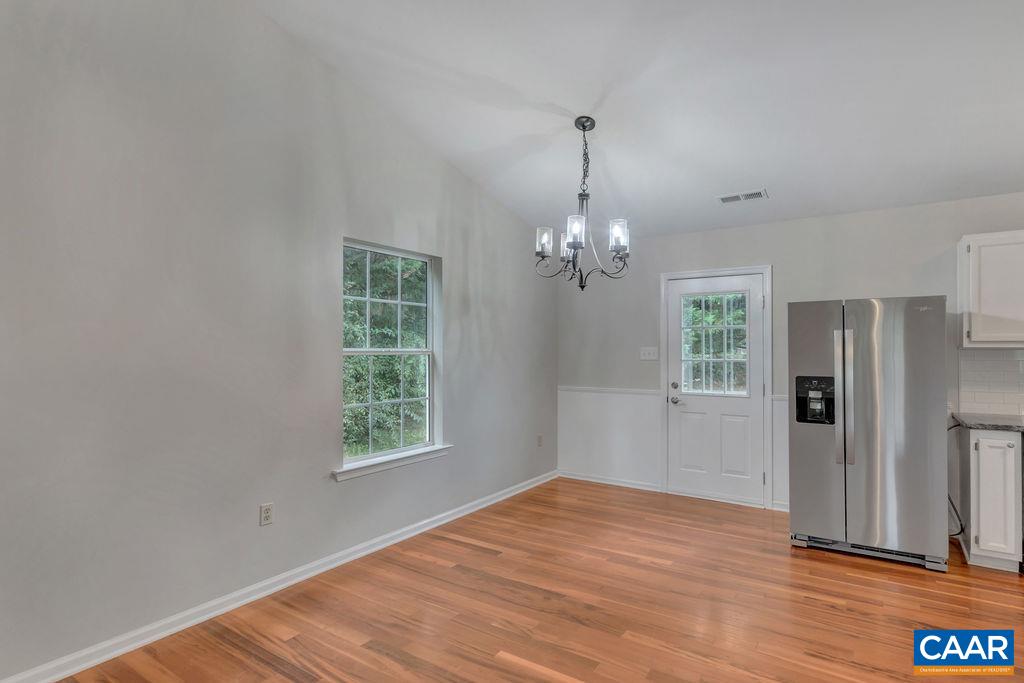 6807 Spring Hill Road Ruckersville, VA 22968 - Photo 17 of 37 a view of empty room with wooden floor and fan