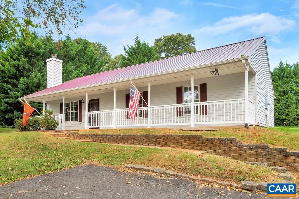 6807 Spring Hill Road Ruckersville, VA 22968 - Photo 3 of 37 a front view of a house with a yard