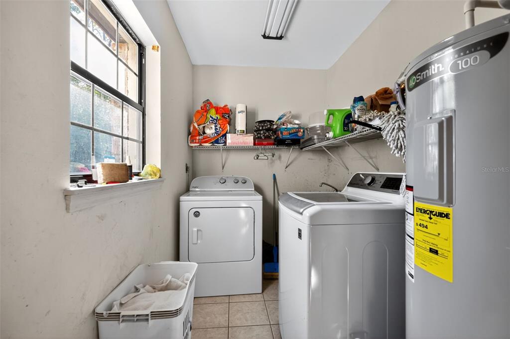 1925 Northwest 60th Avenue Ocala, FL 34482 - Photo 12 of 29 a utility room with dryer and washer