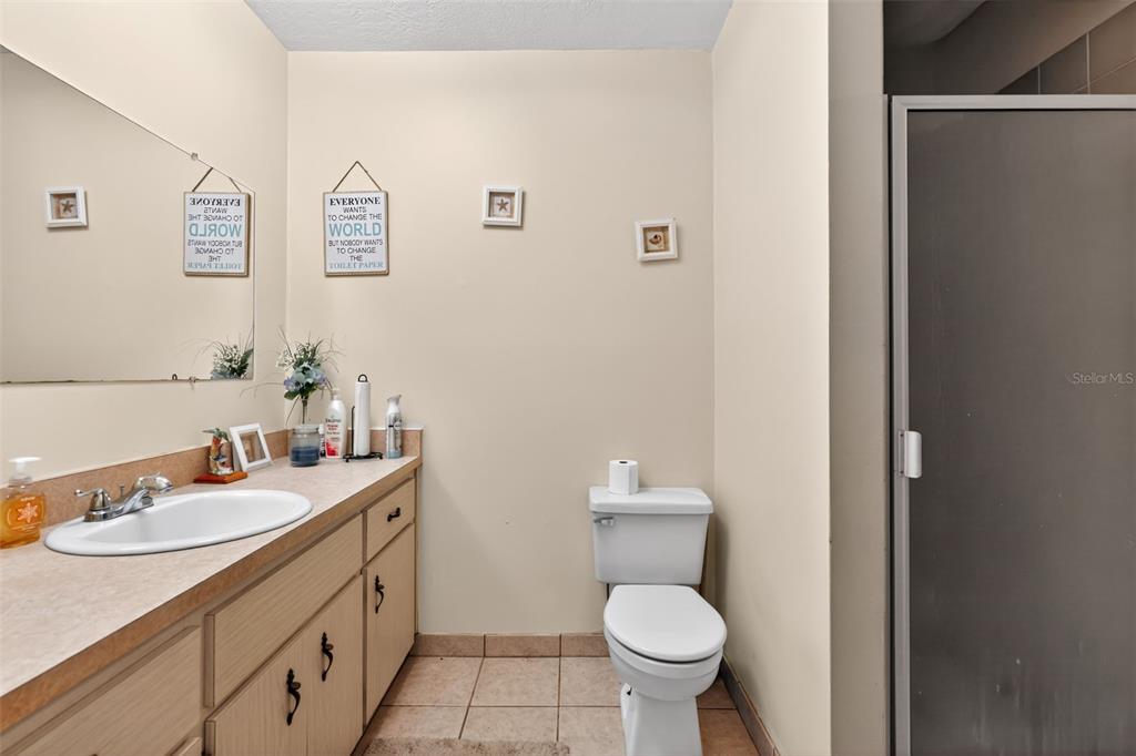 1925 Northwest 60th Avenue Ocala, FL 34482 - Photo 13 of 29 a bathroom with a sink toilet and a mirror