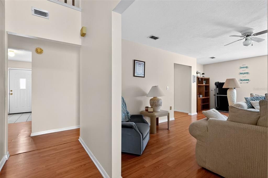 1925 Northwest 60th Avenue Ocala, FL 34482 - Photo 23 of 29 a living room with furniture and wooden floor