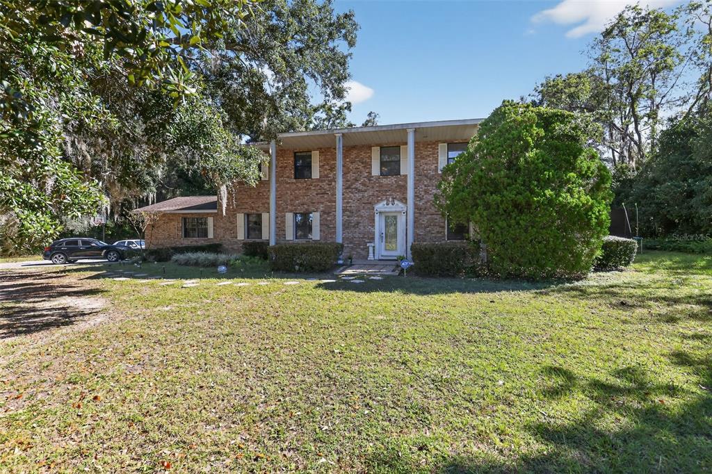1925 Northwest 60th Avenue Ocala, FL 34482 - Photo 26 of 29 a view of a house with a yard