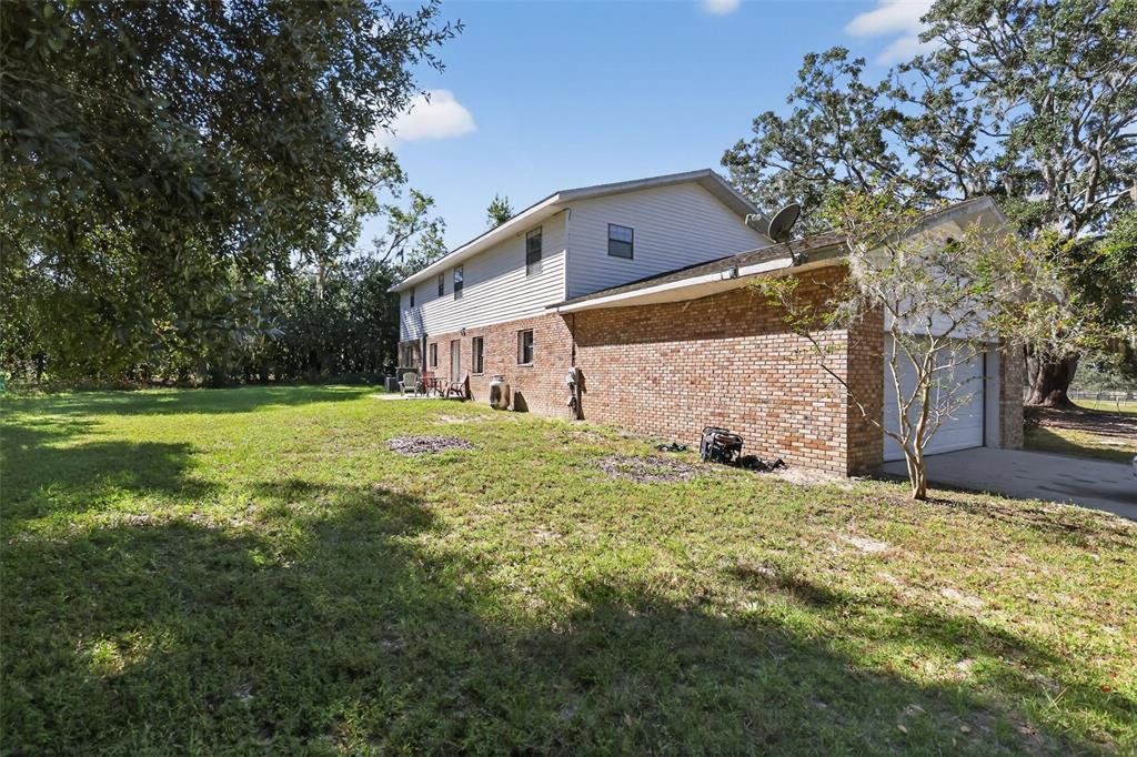 1925 Northwest 60th Avenue Ocala, FL 34482 - Photo 29 of 29 a backyard of a house with lots of green space