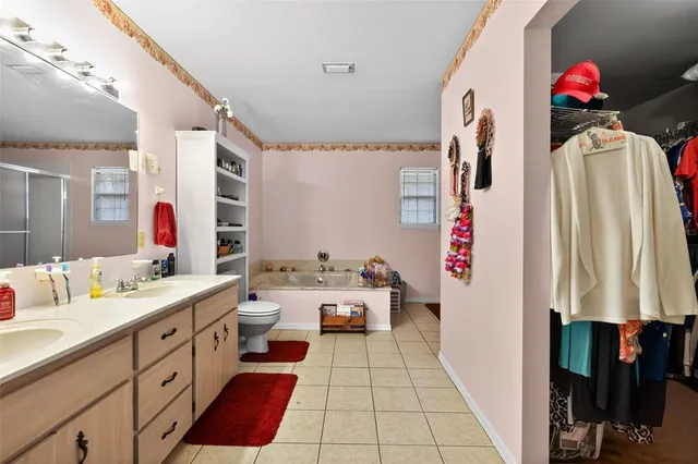 a bathroom with a sink vanity and a mirror