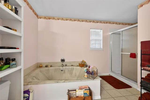 a bathroom with a tub and shower curtain