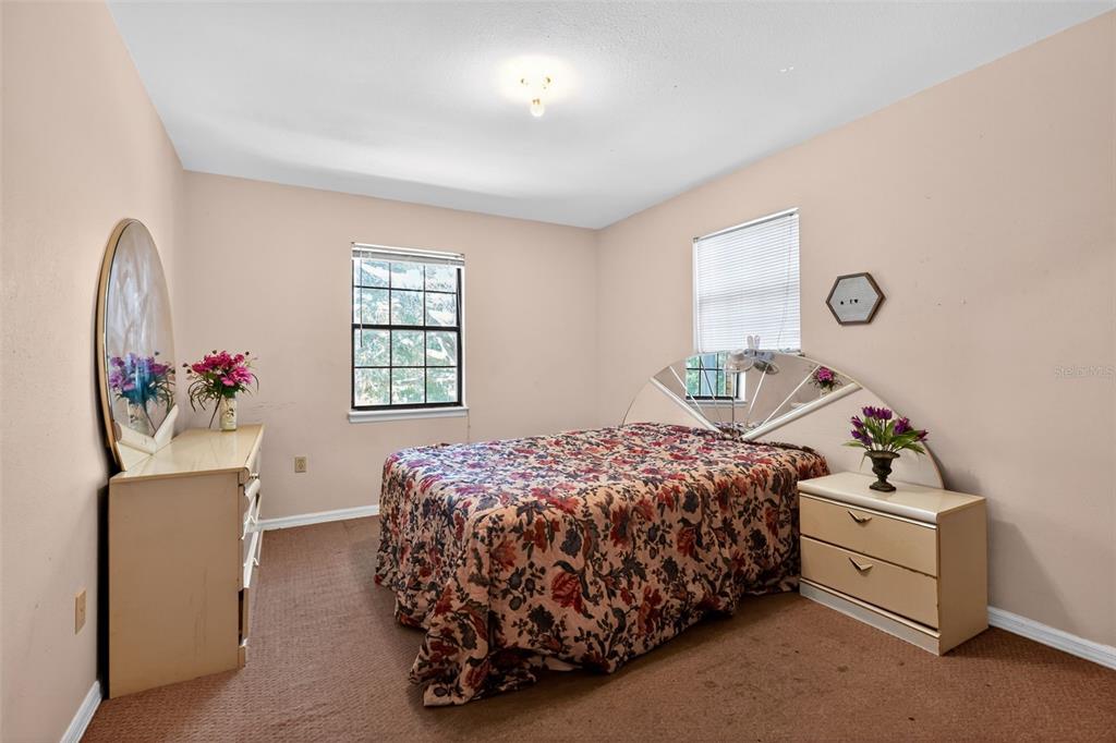 1925 Northwest 60th Avenue Ocala, FL 34482 - Photo 10 of 29 a bedroom with a bed and a window