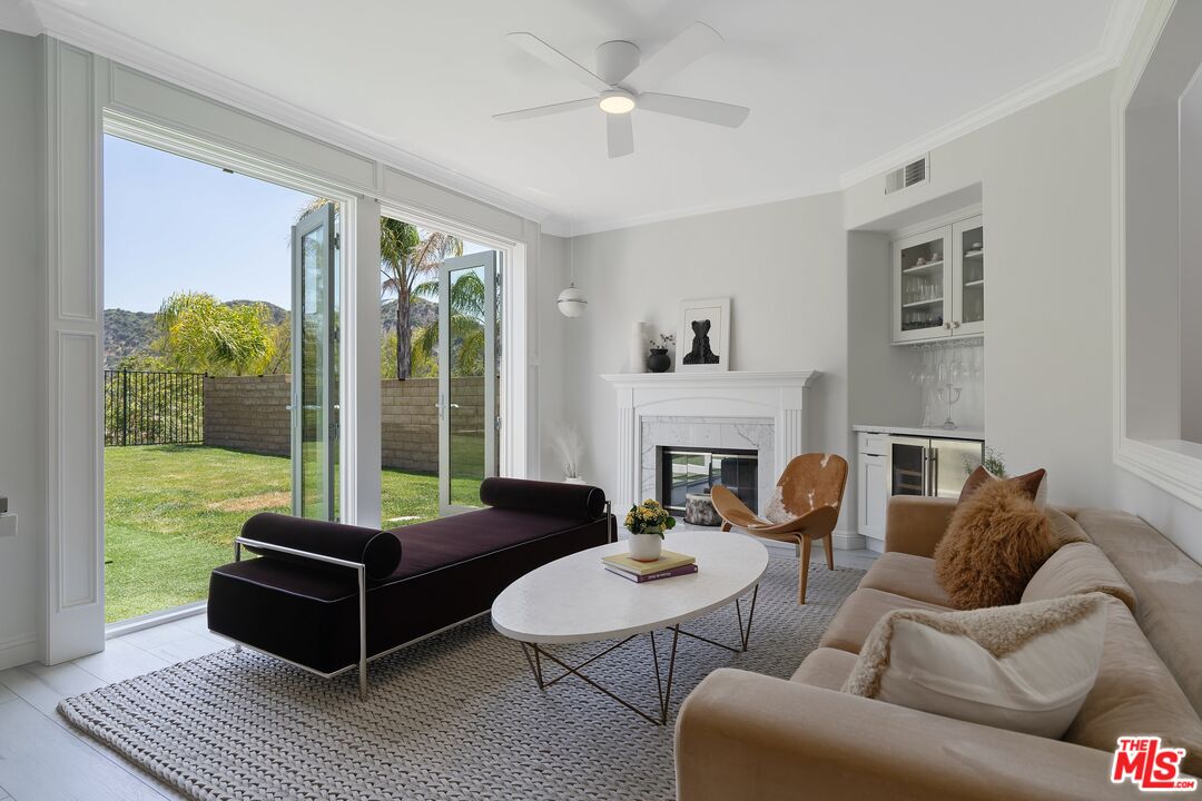 25614 Lewis Way Stevenson Ranch, CA 91381 - Photo 13 of 55 a living room with furniture and a floor to ceiling window