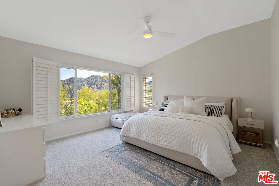 25614 Lewis Way Stevenson Ranch, CA 91381 - Photo 28 of 55 a bedroom with a large bed and a large window
