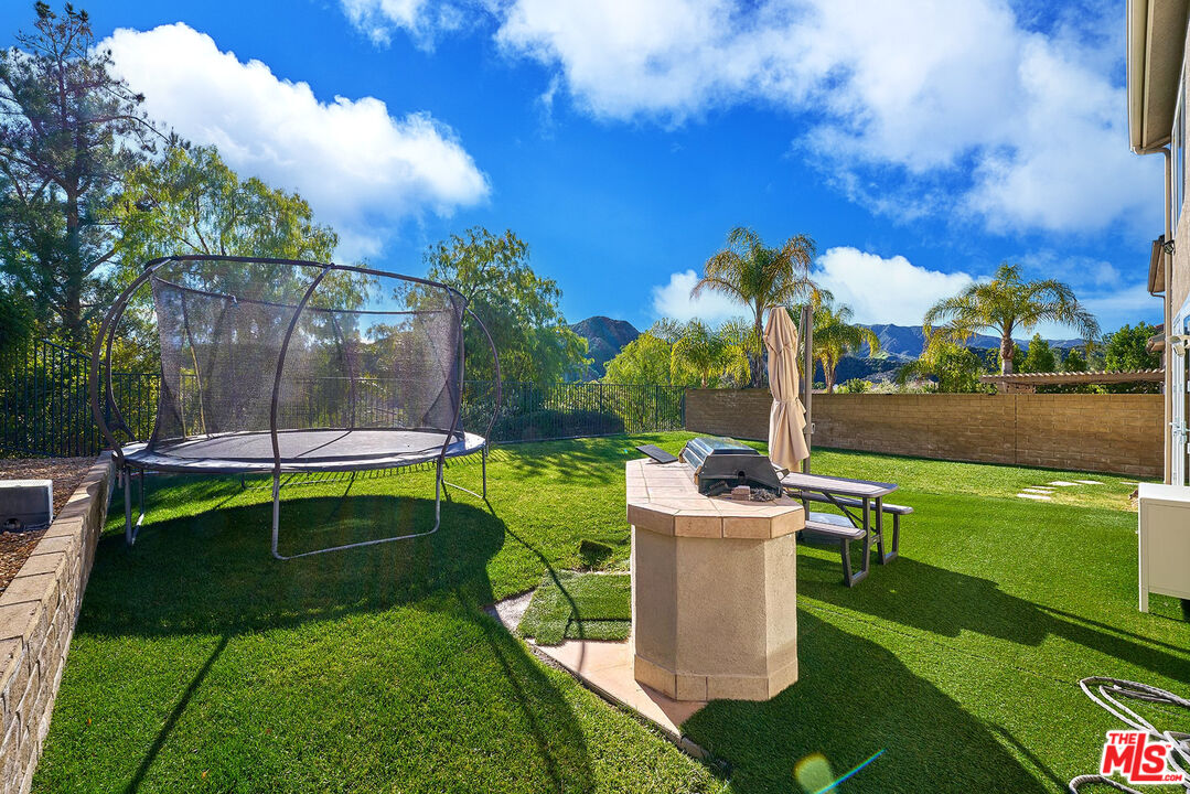 25614 Lewis Way Stevenson Ranch, CA 91381 - Photo 52 of 55 a garden view with a seating space