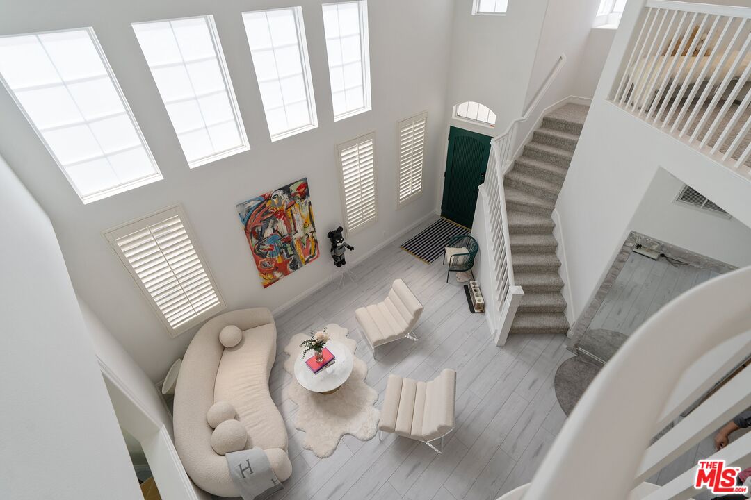 25614 Lewis Way Stevenson Ranch, CA 91381 - Photo 7 of 55 a living room with furniture and a large window