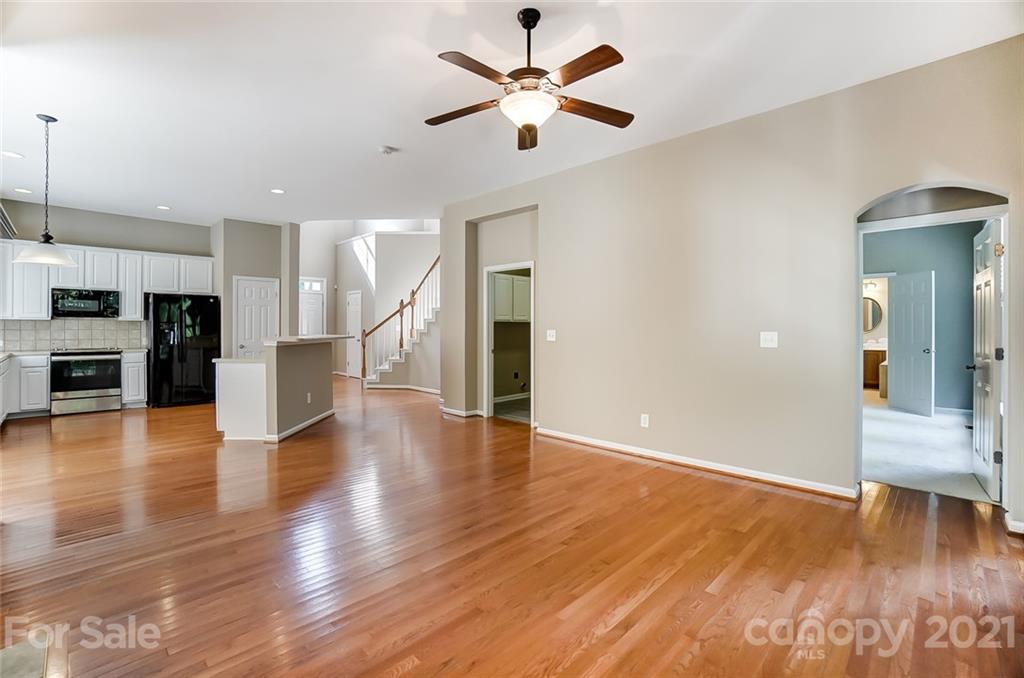 142 Blandina Court Fort Mill, SC 29708 - Photo 14 of 40 a view of a kitchen with a ceiling fan hardwood floor and a kitchen