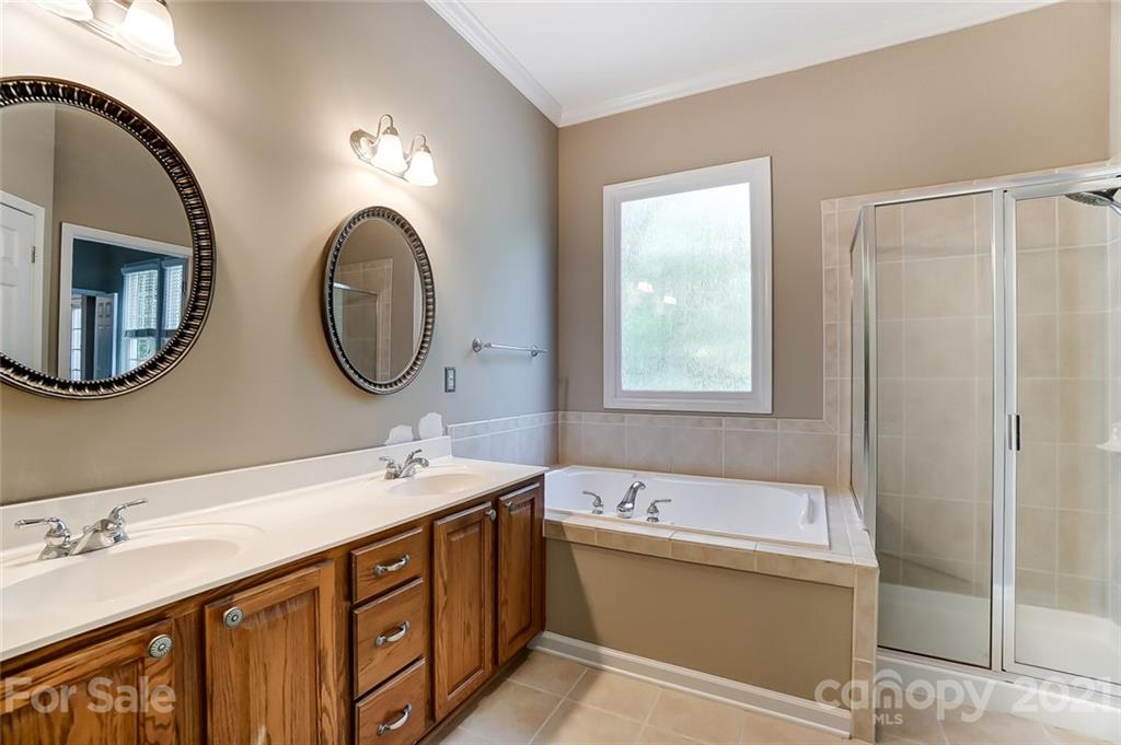 142 Blandina Court Fort Mill, SC 29708 - Photo 21 of 40 a bathroom with a double vanity sink mirror and bathtub