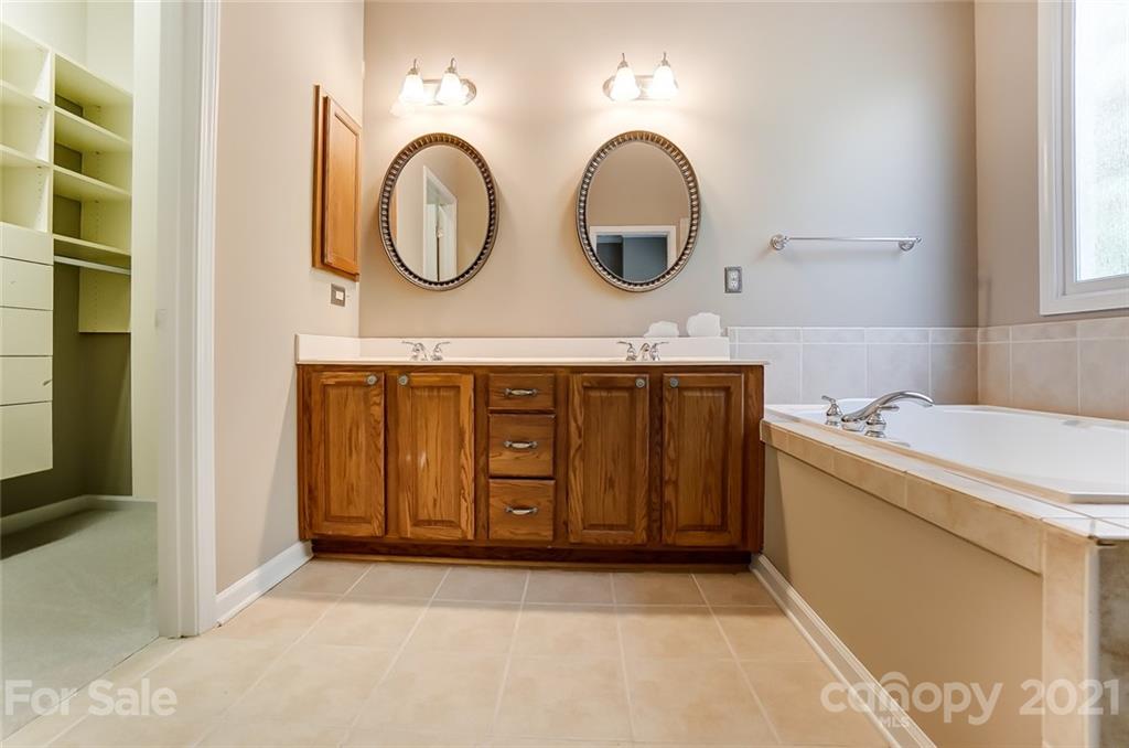 142 Blandina Court Fort Mill, SC 29708 - Photo 22 of 40 a bathroom with a sink and a mirror