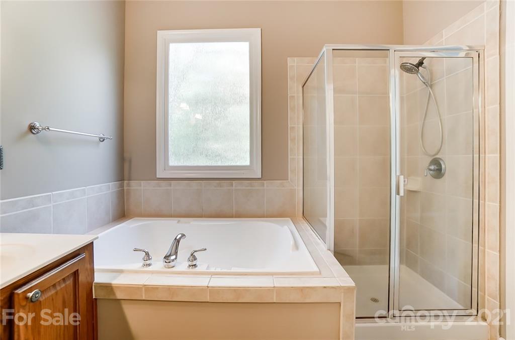 142 Blandina Court Fort Mill, SC 29708 - Photo 23 of 40 a bathroom with a bath tub and a shower