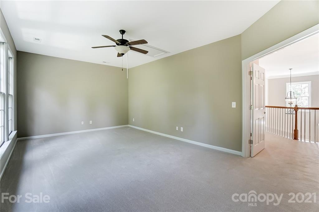 142 Blandina Court Fort Mill, SC 29708 - Photo 31 of 40 an empty room with chandelier fan and windows
