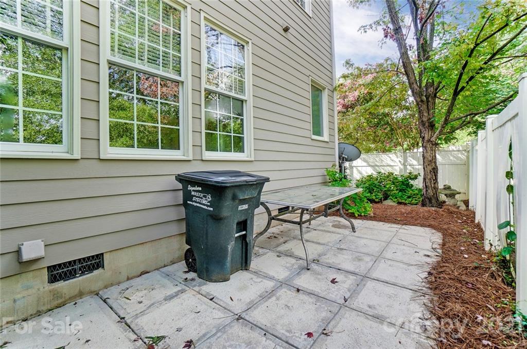 142 Blandina Court Fort Mill, SC 29708 - Photo 39 of 40 a view of a patio with table and chairs and potted plants