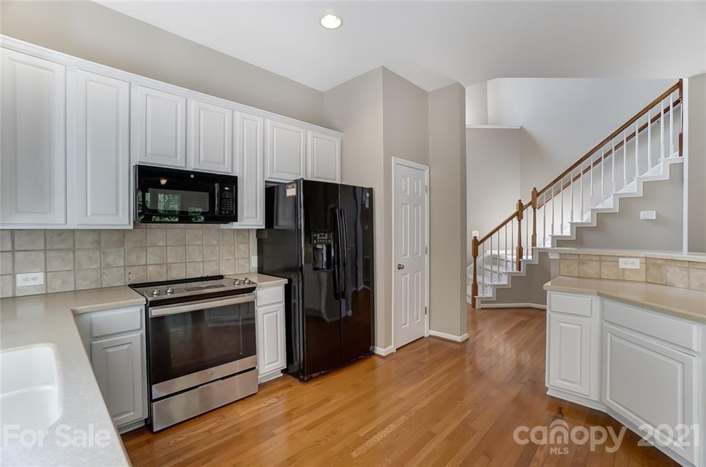 142 Blandina Court Fort Mill, SC 29708 - Photo 8 of 40 a kitchen with a sink and steel stainless steel appliances