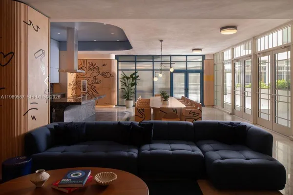 a living room with furniture and a large window