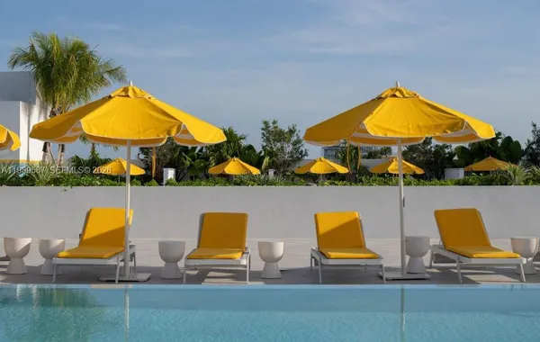 a view of swimming pool with seating area