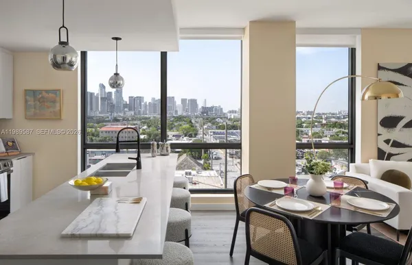 a view of a dining room with furniture window and outside view