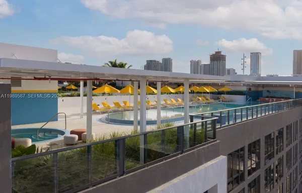 a view of swimming pool from a balcony