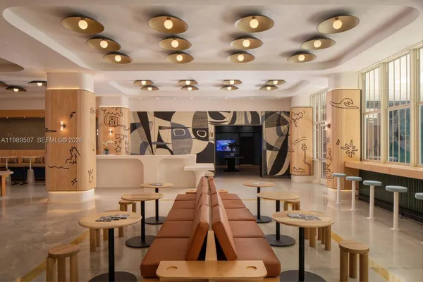 a living room with lots of furniture and gym equipment