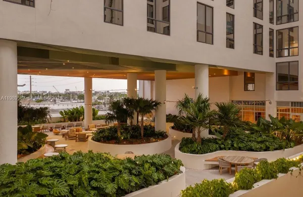 a view of a porch with plants and a potted plant