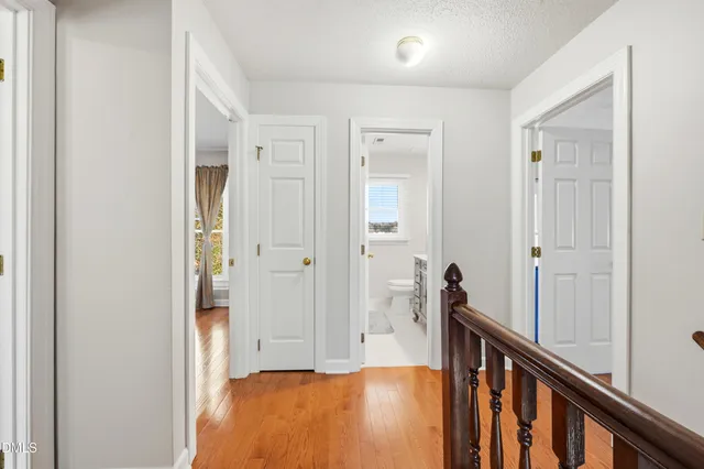 a bed room with a bed and a chandelier