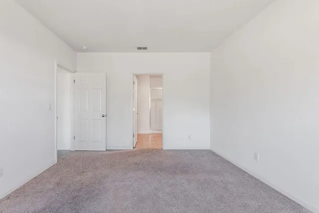 a bathroom with a double vanity sink and mirror