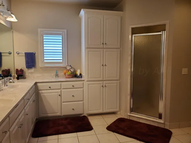 a kitchen with a refrigerator and a sink