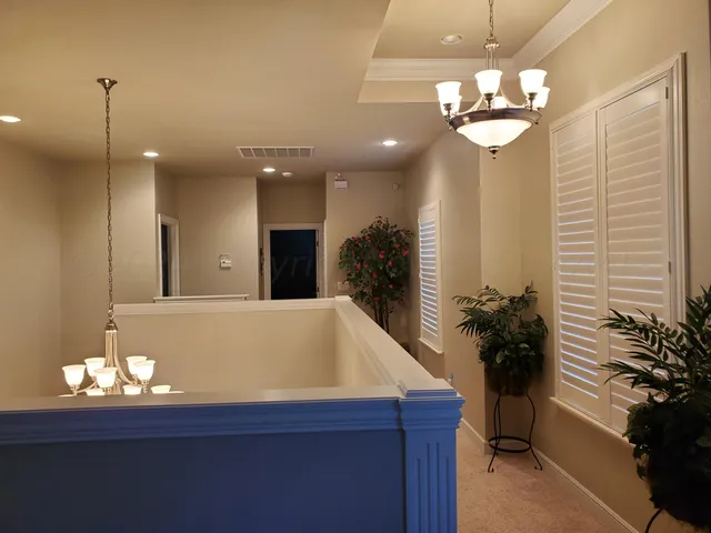 a view of a lobby area and a chandelier