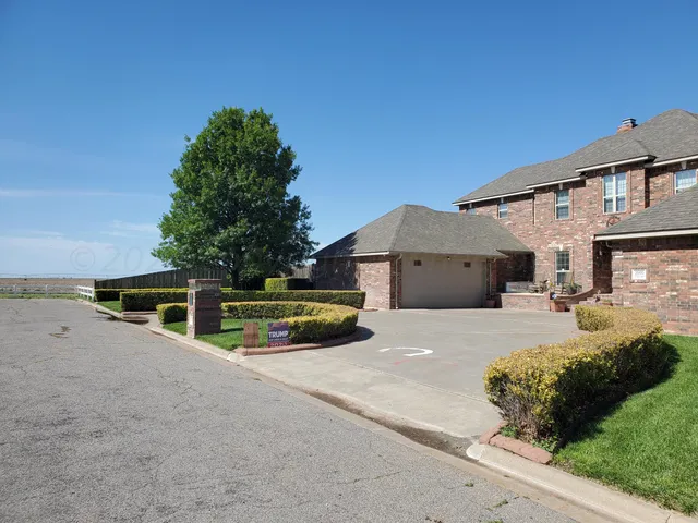 a view of house with yard and entertaining space