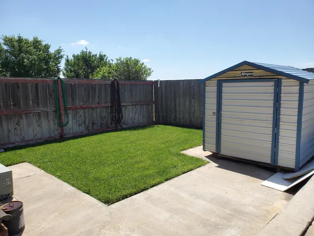 a view of a back yard of the house