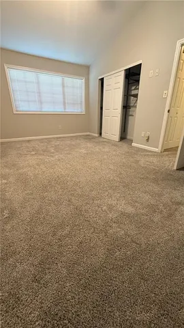 a view of an empty room with windows