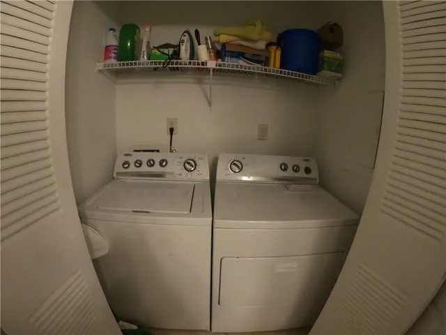 a view of staircase with rug