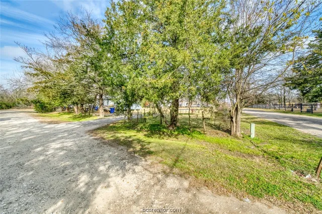 a view of street with parked cars
