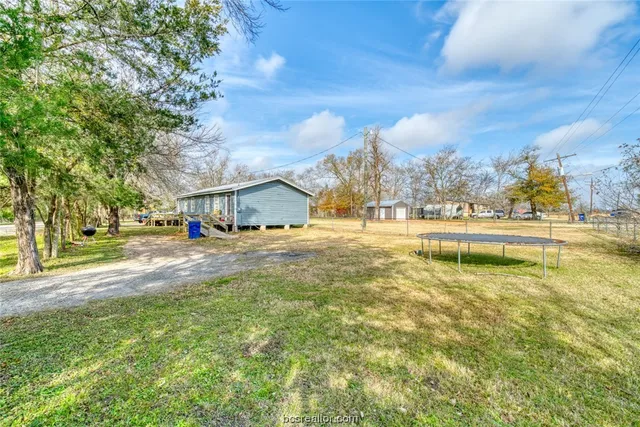 a view of a house with swimming pool