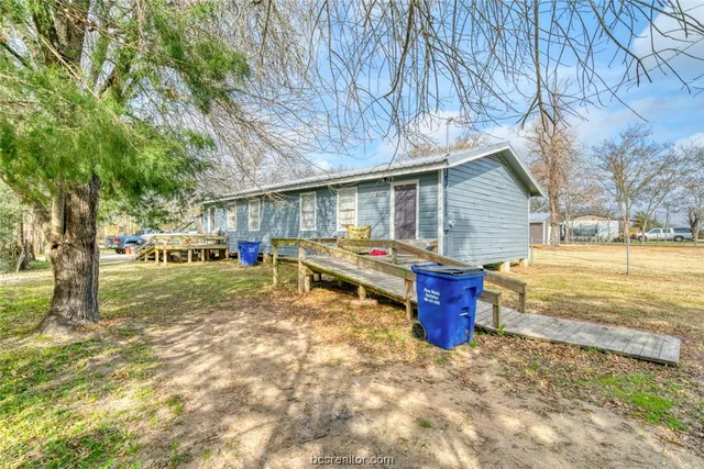 a house with trees in the background