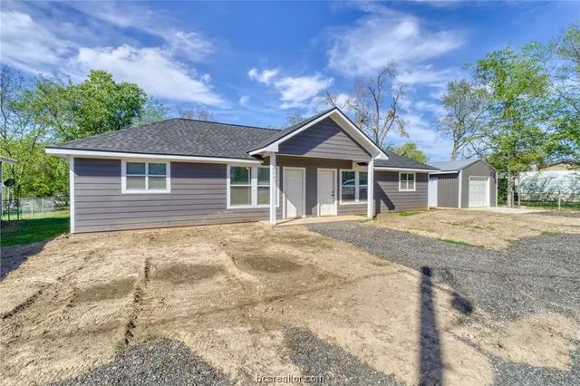 a house with trees in the background