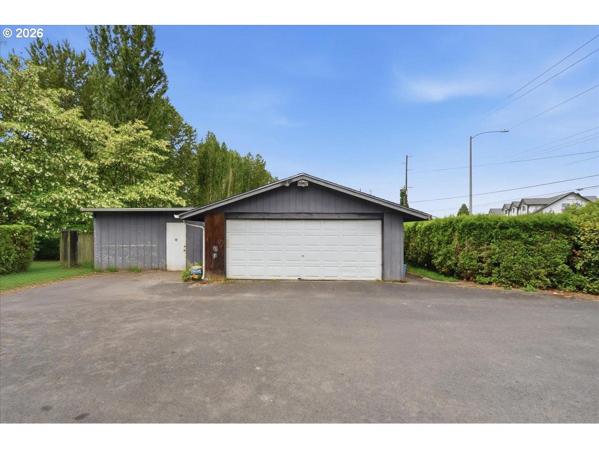 3287 Olive Way Longview, WA 98632 - Photo 24 of 24 a view of a house with a yard and garage