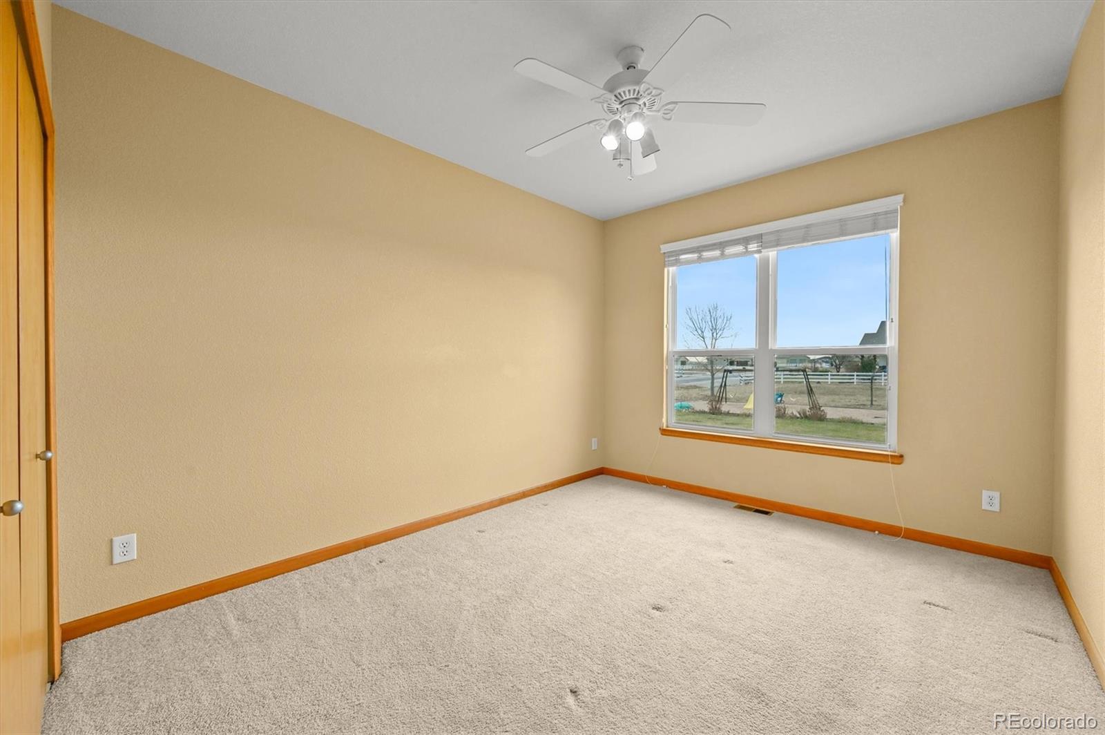 16231 Rayburn Street Hudson, CO 80642 - Photo 18 of 50 an empty room with a window