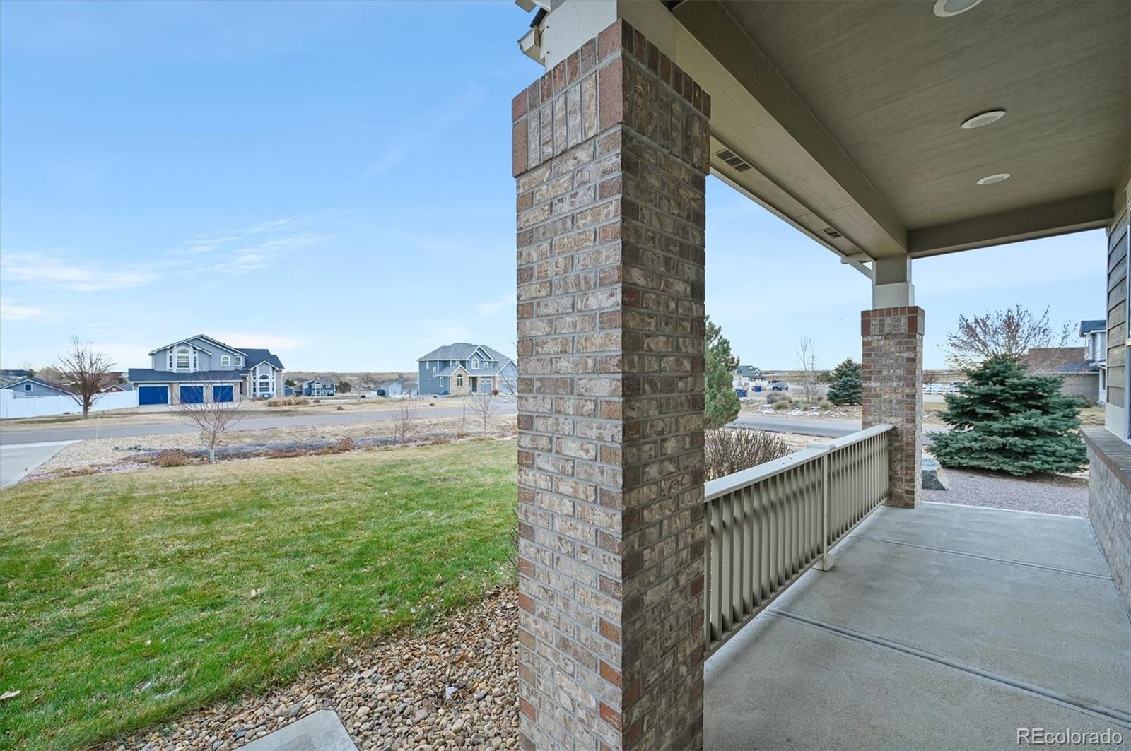 16231 Rayburn Street Hudson, CO 80642 - Photo 2 of 50 a view of balcony with yard