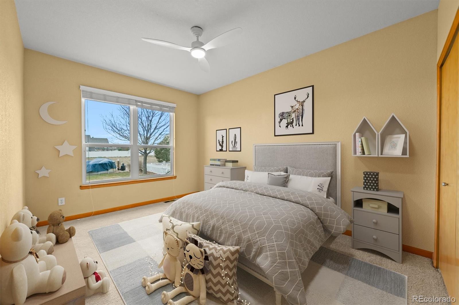 16231 Rayburn Street Hudson, CO 80642 - Photo 21 of 50 a bedroom with a bed and a painting on the wall