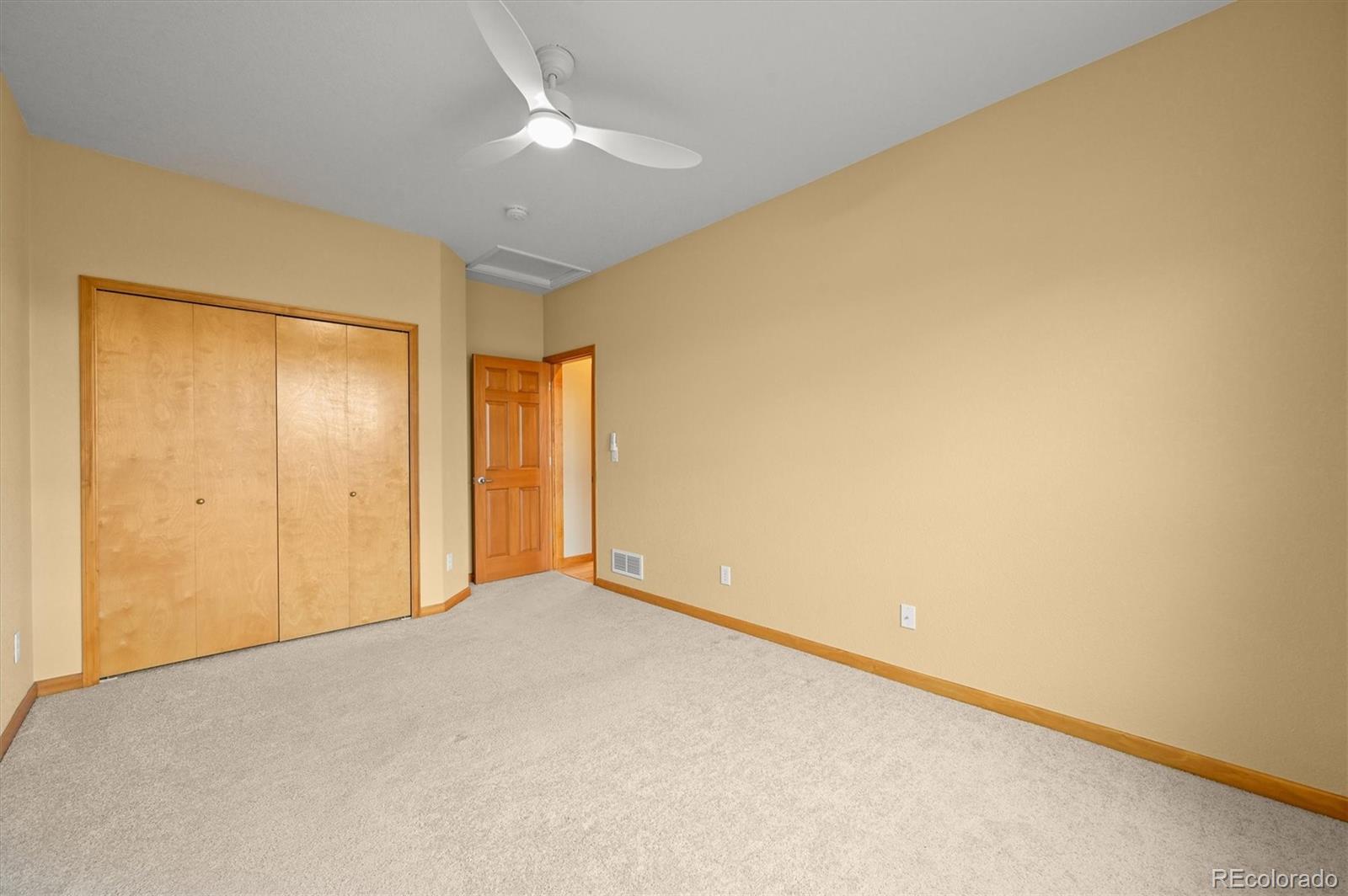 16231 Rayburn Street Hudson, CO 80642 - Photo 22 of 50 a view of an empty room and a window