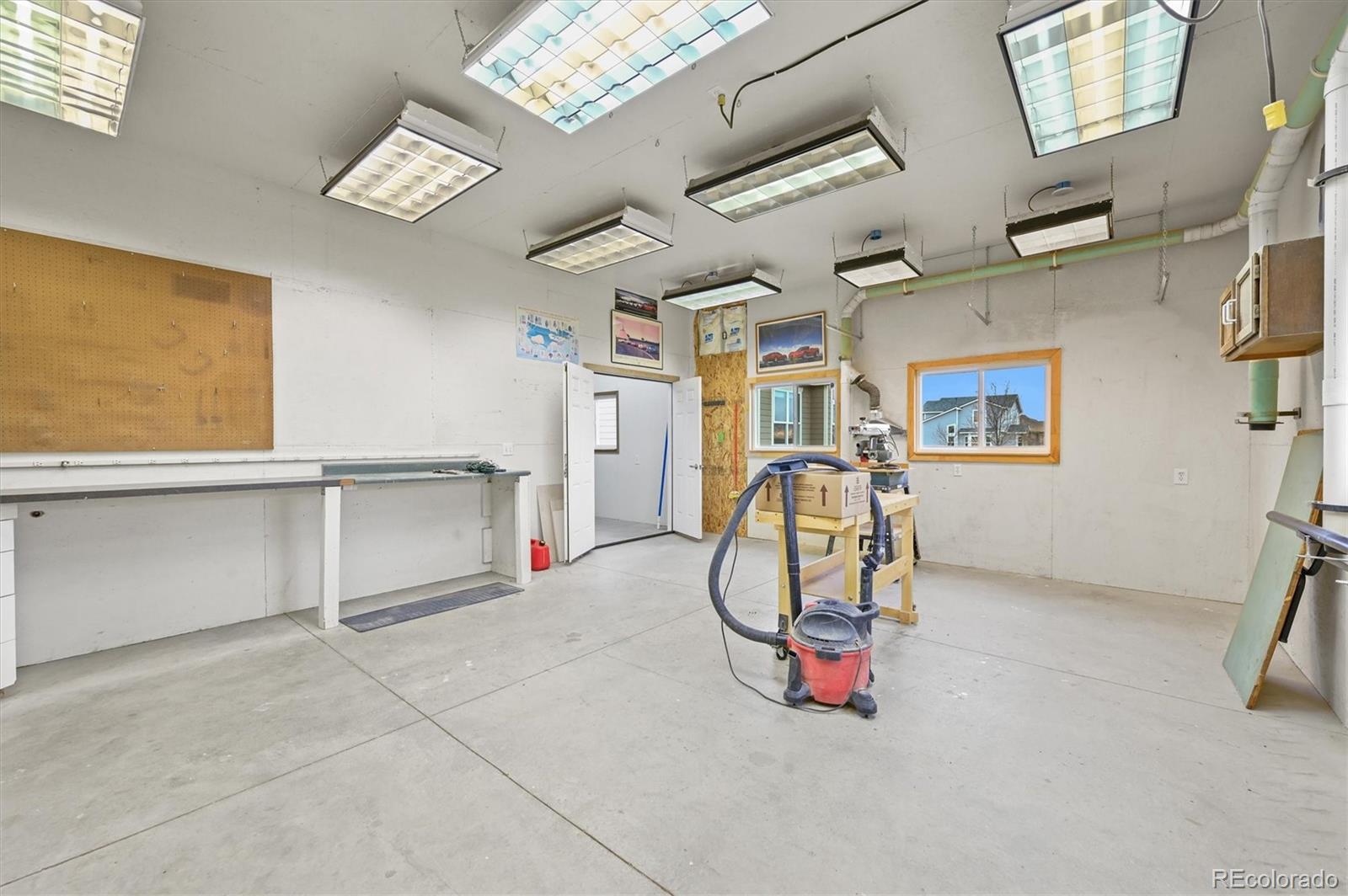 16231 Rayburn Street Hudson, CO 80642 - Photo 29 of 50 a view of a livingroom with furniture and a window