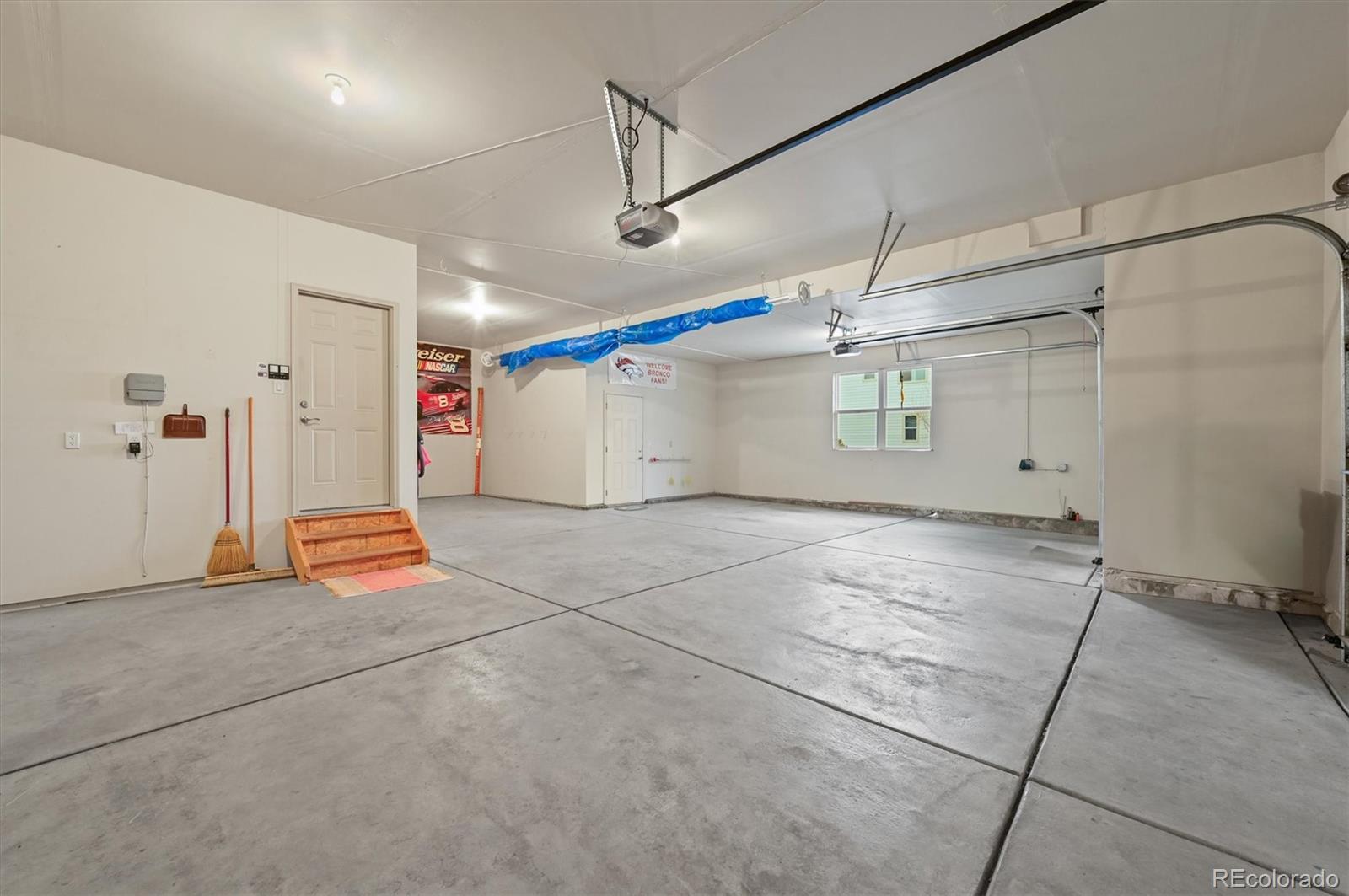 16231 Rayburn Street Hudson, CO 80642 - Photo 32 of 50 a view of a room with gym equipment and a table chair
