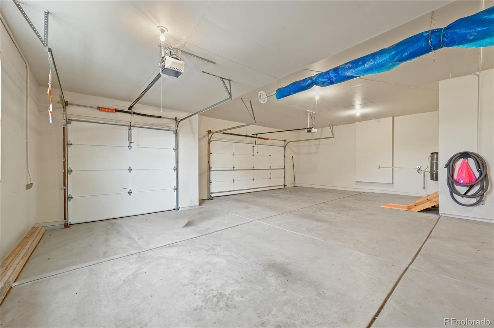 16231 Rayburn Street Hudson, CO 80642 - Photo 39 of 50 a view of a garage with furniture