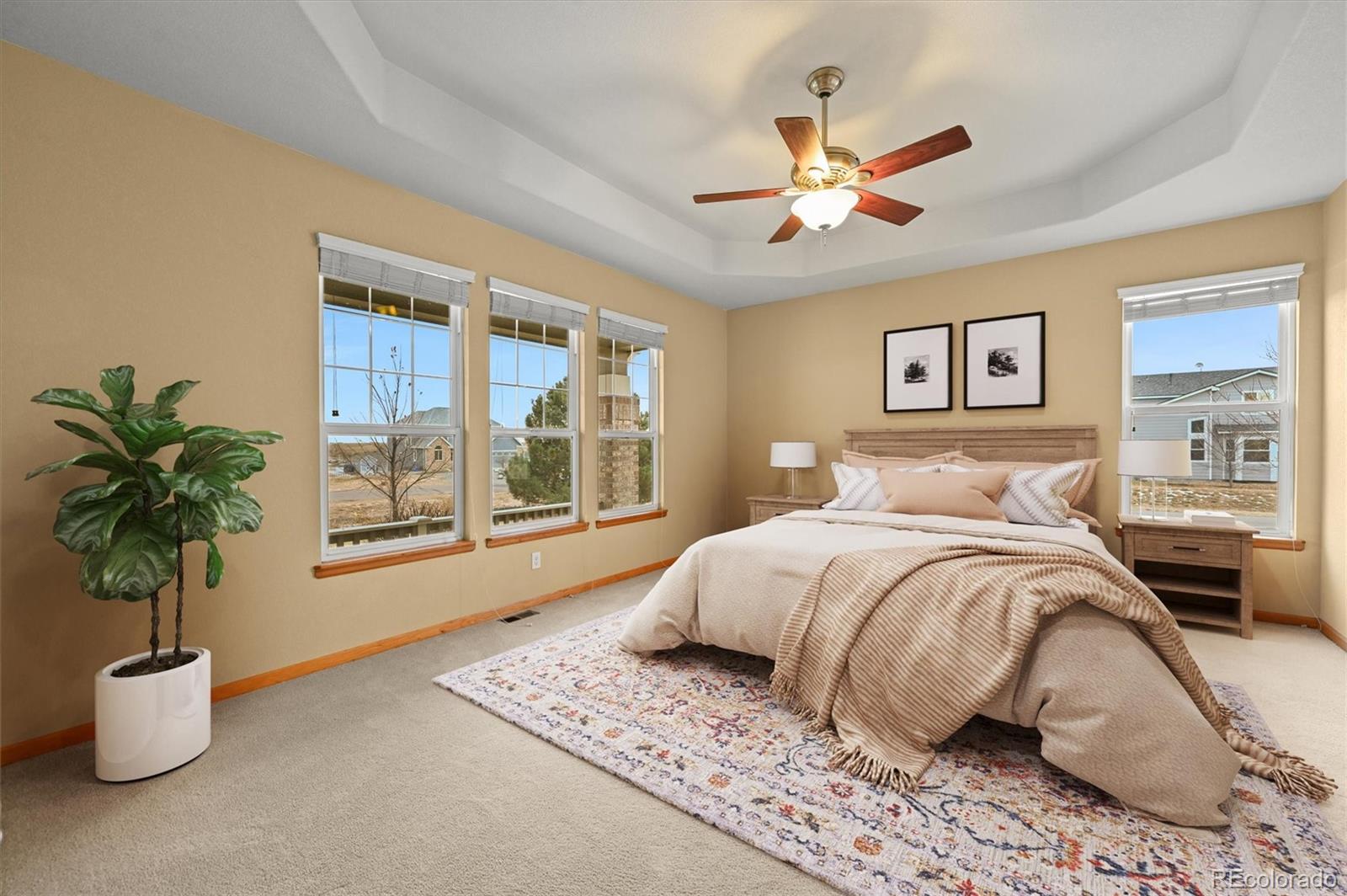 16231 Rayburn Street Hudson, CO 80642 - Photo 4 of 50 a bedroom with a large bed and a window