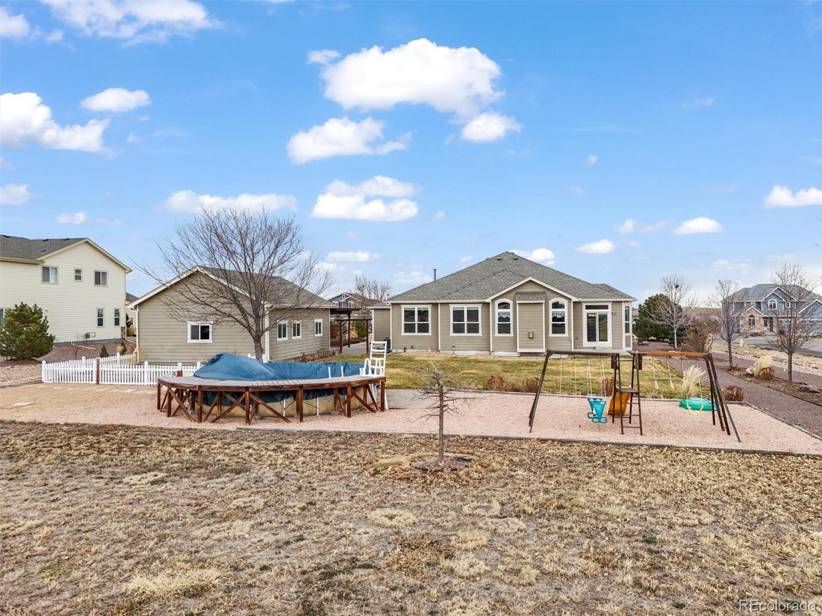 16231 Rayburn Street Hudson, CO 80642 - Photo 45 of 50 a front view of a house with a yard